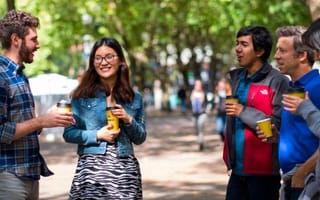 Qualtrics coworkers having an outdoor meeting
